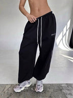 Maelle | Women's Baggy-Fit Sweatpants with Side Stripe, Wide-Leg Lounge Trousers | The Dress Cellar | Brown