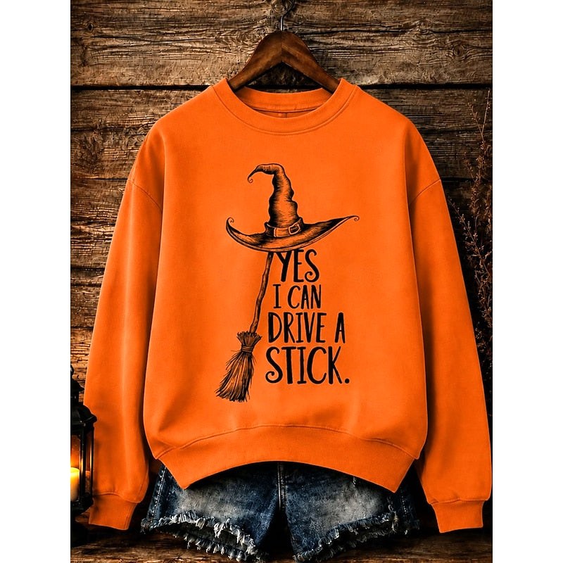 Megan | Women's Halloween Witch Graphic Sweatshirt, Relaxed Crew Neck Sweater | The Dress Cellar | Orange