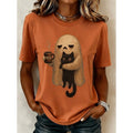 Rachel | Women's Ghost Cat Halloween Graphic Tee, Relaxed Crew Neck T-Shirt | The Dress Cellar | Orange